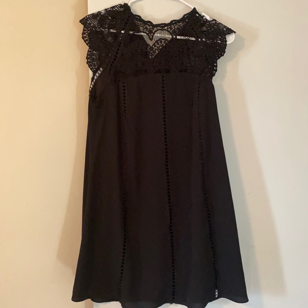 Black dress with crochet detail.
